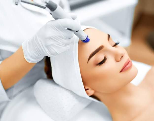Woman receiving facial
